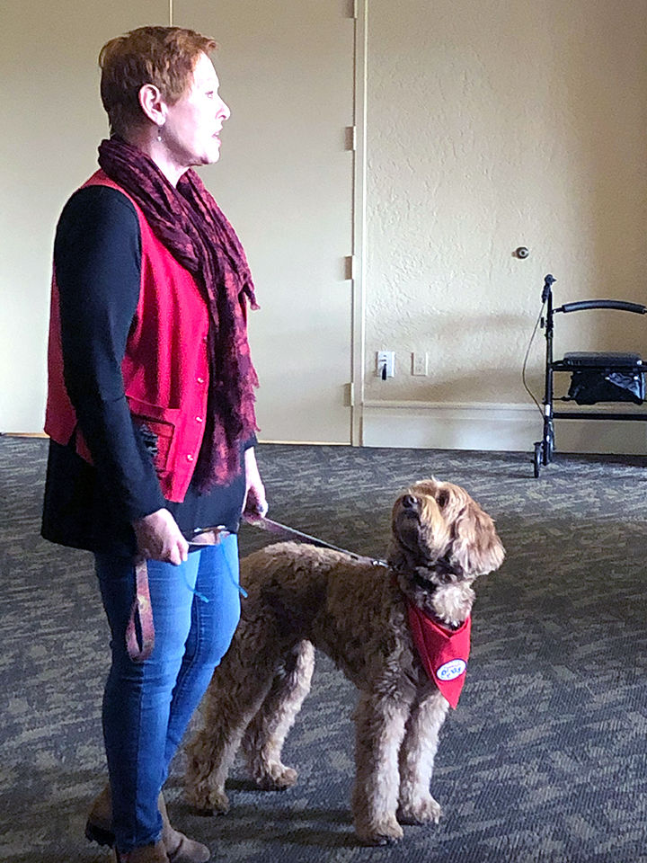 Carolyn Ritchie and her therapy dog, Elliot.